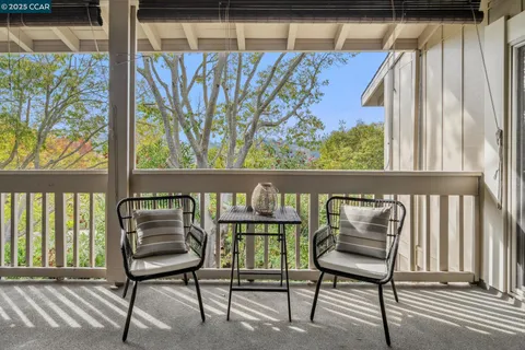 a view of balcony and wooden floor