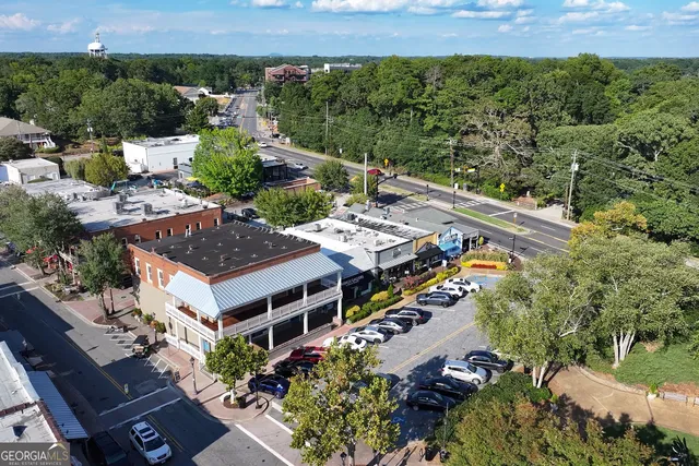 a front view of a building with sitting area