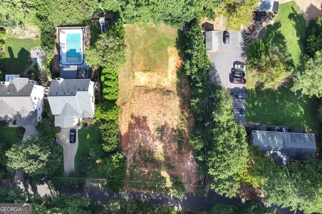 an aerial view of a house with a yard and garden