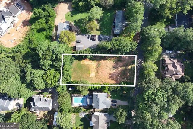 an aerial view of residential house with outdoor space and swimming pool