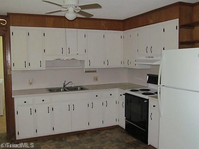 356 Christian Home Church Road Traphill, NC 28685 - Photo 2 of 16 Kitchen. Stove & New Refrigerator convey. New vinyl & hardware. Large eat-in kitchen that opens to the dinning room