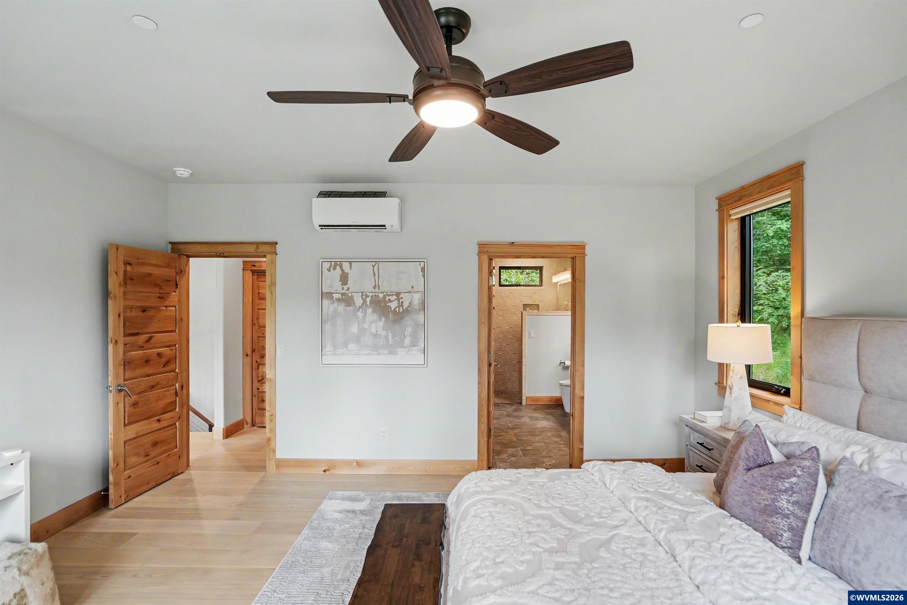 1155 Northwest Country Hills Road Corvallis, OR 97330 - Photo 43 of 48 a bedroom with a bed and a lamp