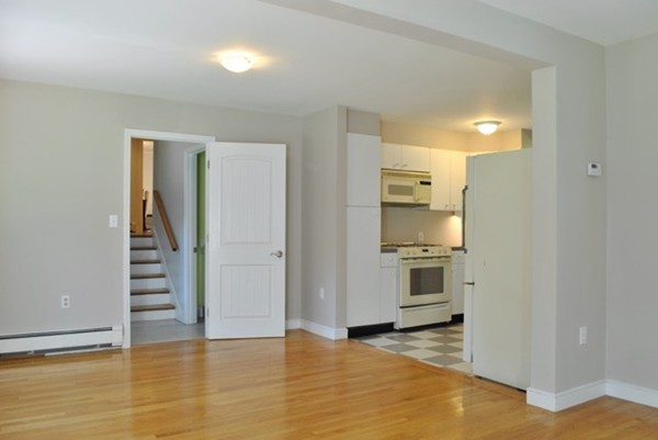 54 Judy Farm Road Carlisle, MA 01741 - Photo 11 of 17 a view of a kitchen with a sink and a refrigerator