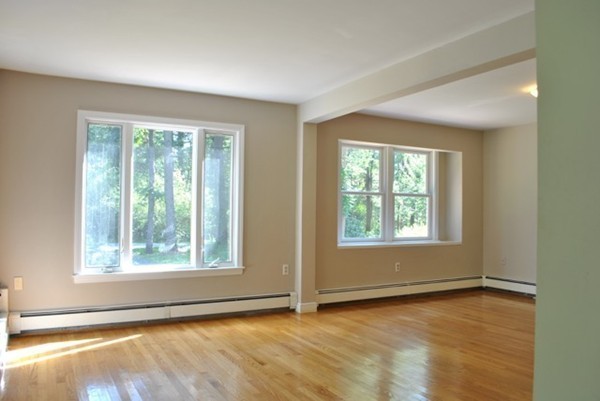 54 Judy Farm Road Carlisle, MA 01741 - Photo 12 of 17 an empty room with wooden floor and windows