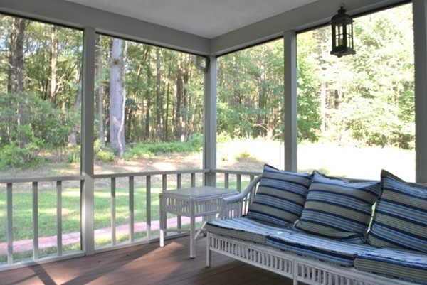 54 Judy Farm Road Carlisle, MA 01741 - Photo 13 of 17 a living room with large windows