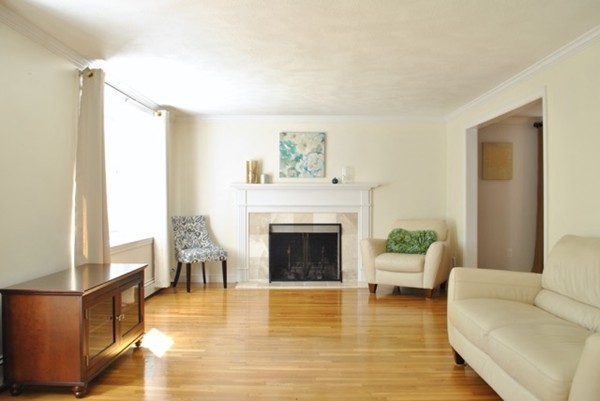 54 Judy Farm Road Carlisle, MA 01741 - Photo 2 of 17 a living room with furniture and a fireplace