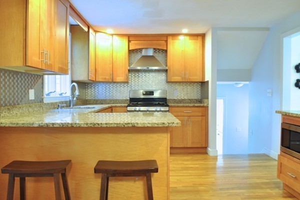 54 Judy Farm Road Carlisle, MA 01741 - Photo 4 of 17 a kitchen with stainless steel appliances granite countertop a sink stove and cabinets