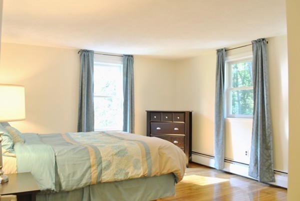 54 Judy Farm Road Carlisle, MA 01741 - Photo 8 of 17 a bedroom with a bed and a window