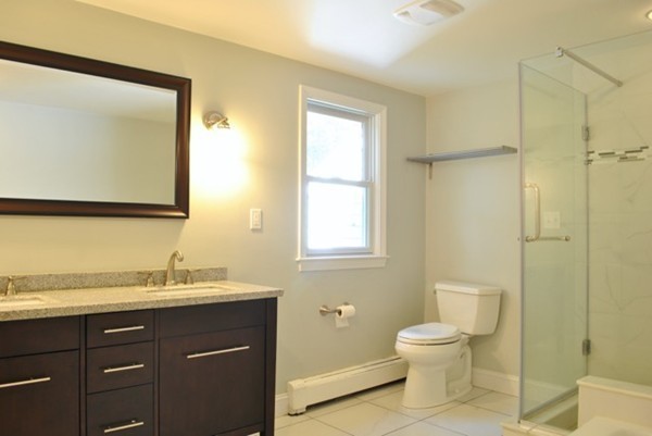 54 Judy Farm Road Carlisle, MA 01741 - Photo 9 of 17 a bathroom with a toilet sink and mirror
