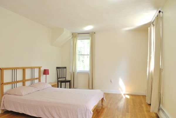 54 Judy Farm Road Carlisle, MA 01741 - Photo 10 of 17 a bedroom with a bed and a table