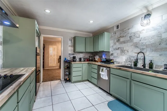 a kitchen with a sink and cabinets