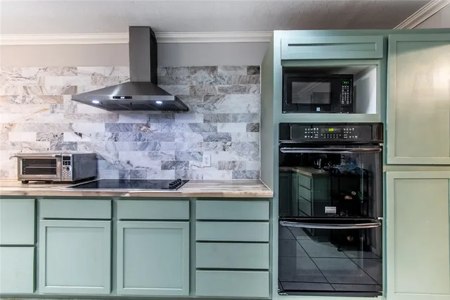 a kitchen with a stove and a microwave