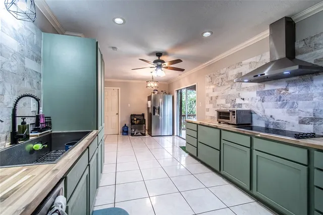 a kitchen with a sink stainless steel appliances and counter space
