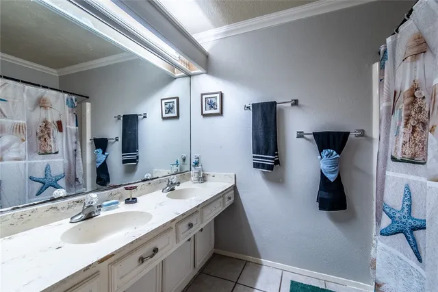 a bathroom with double vanity sink