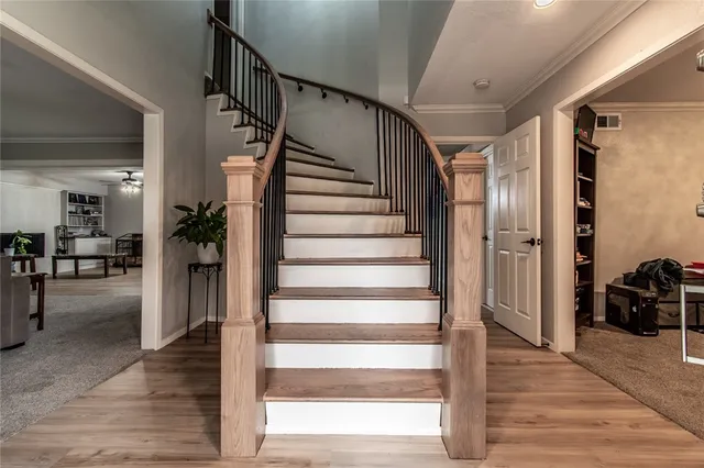 a view of entryway and hall with wooden floor