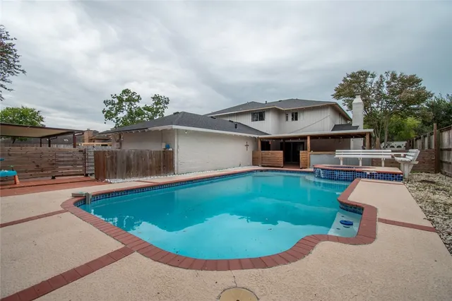 a view of a house with swimming pool