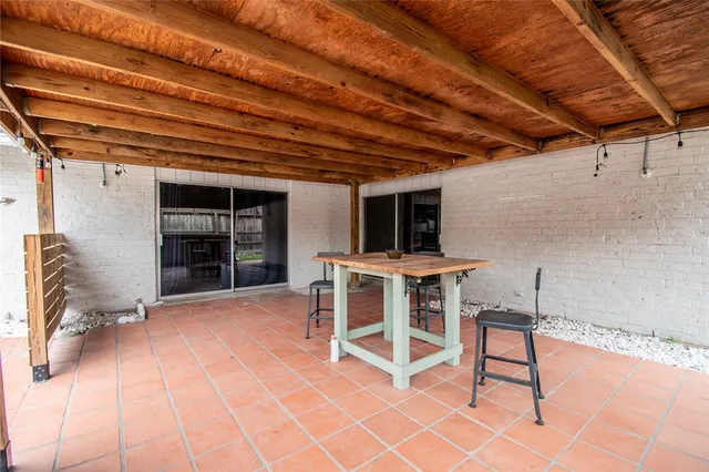 a view of a chairs and table in the patio