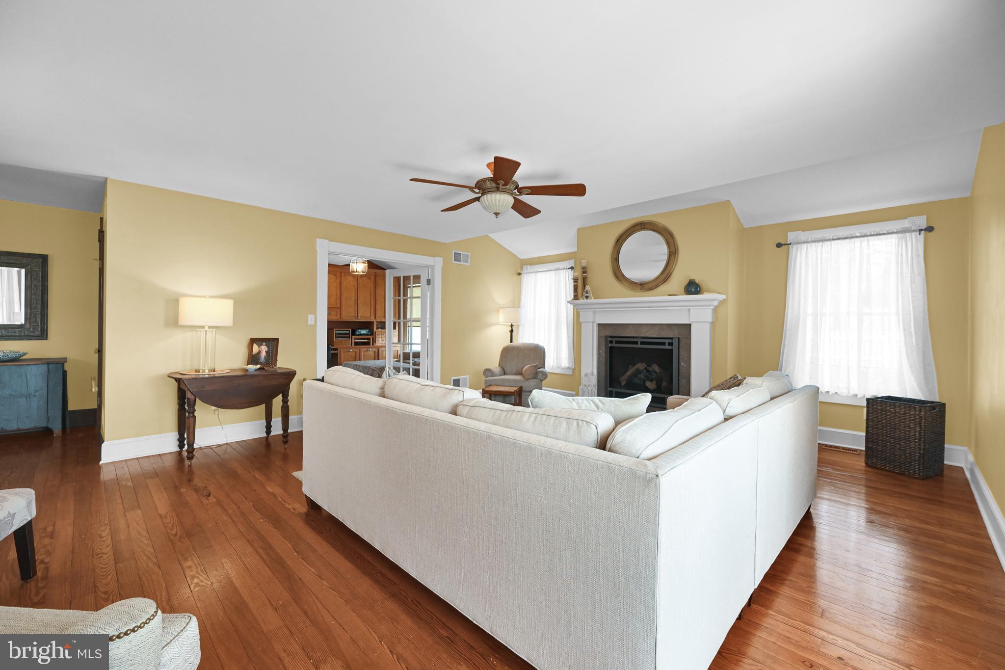 4207 Beckleysville Road Hampstead, MD 21074 - Photo 20 of 68 a living room with furniture a fireplace and a clock