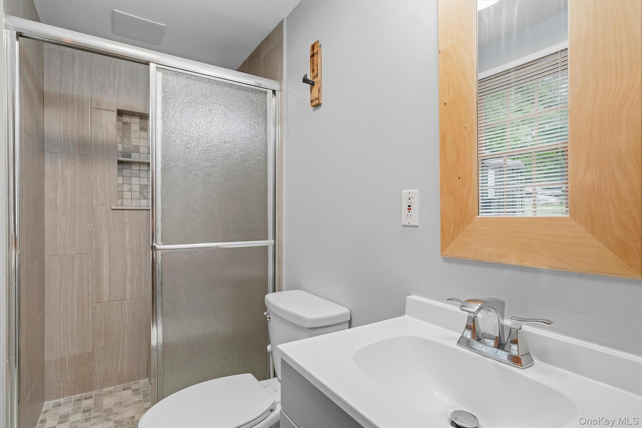 318 Beattie Road Washingtonville, NY 10992 - Photo 26 of 42 a bathroom with a sink toilet and shower