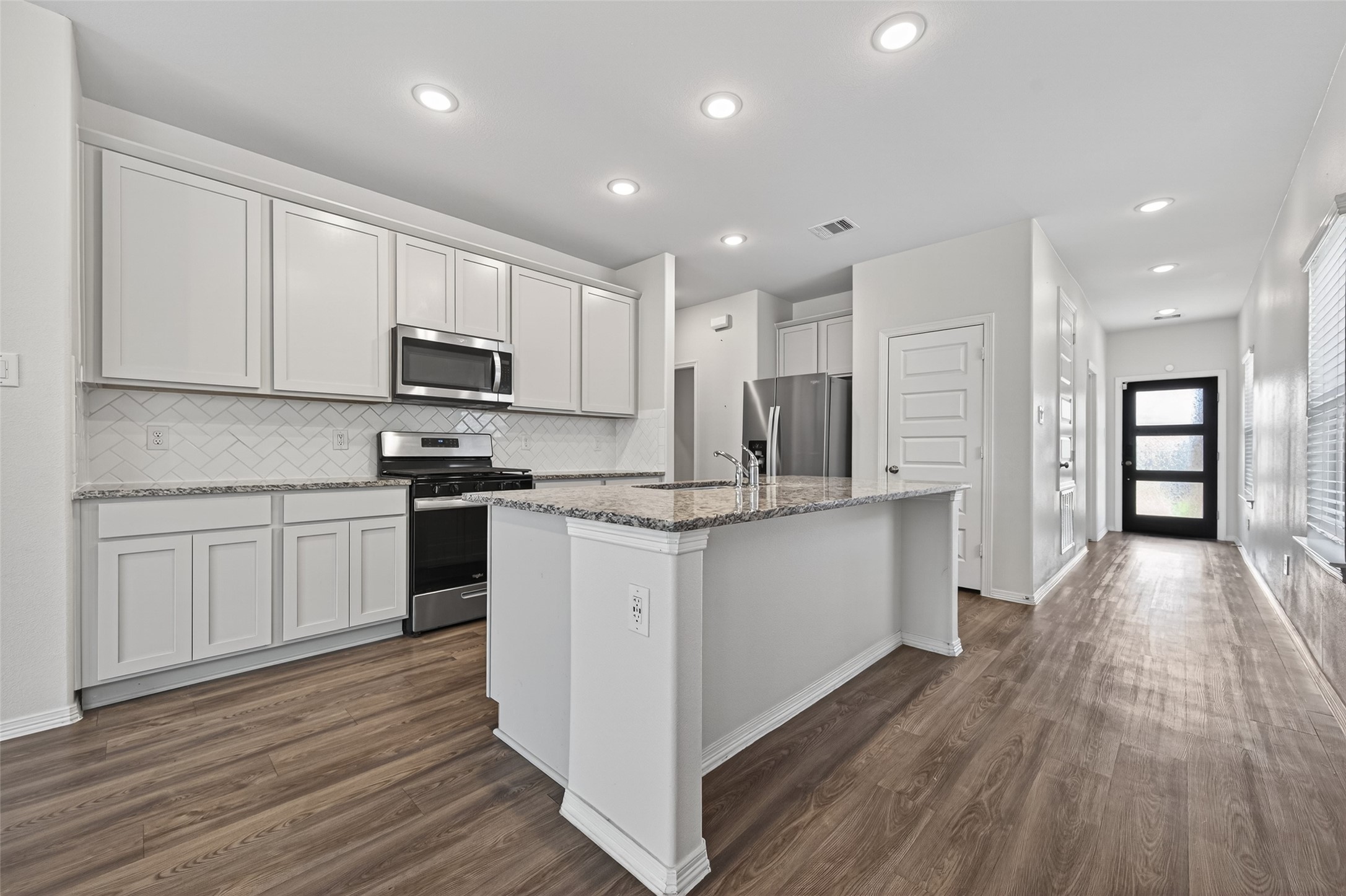 23222 Spring Genesis Lane Katy, TX 77493 - Photo 14 of 43 The space is enhanced by the incorporation of modern recessed lighting.