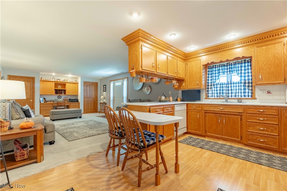 90480 Kilgore Ridge Road Scio, OH 43988 - Photo 39 of 39 Kitchen with light wood finished floors, light countertops, open floor plan, a peninsula, and dishwasher