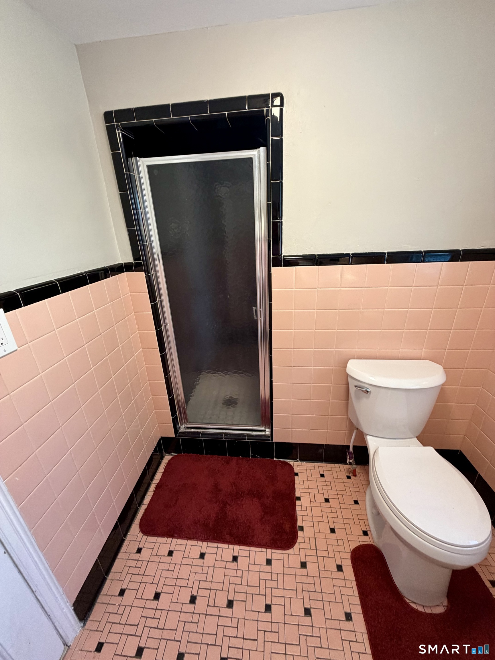 40 Nepaug Street Hartford, CT 06106 - Photo 14 of 19 a bathroom with a toilet and a shower