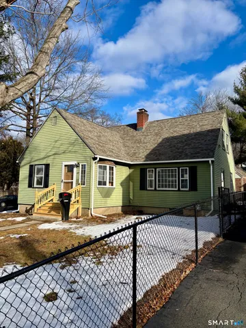 a front view of a house with yard