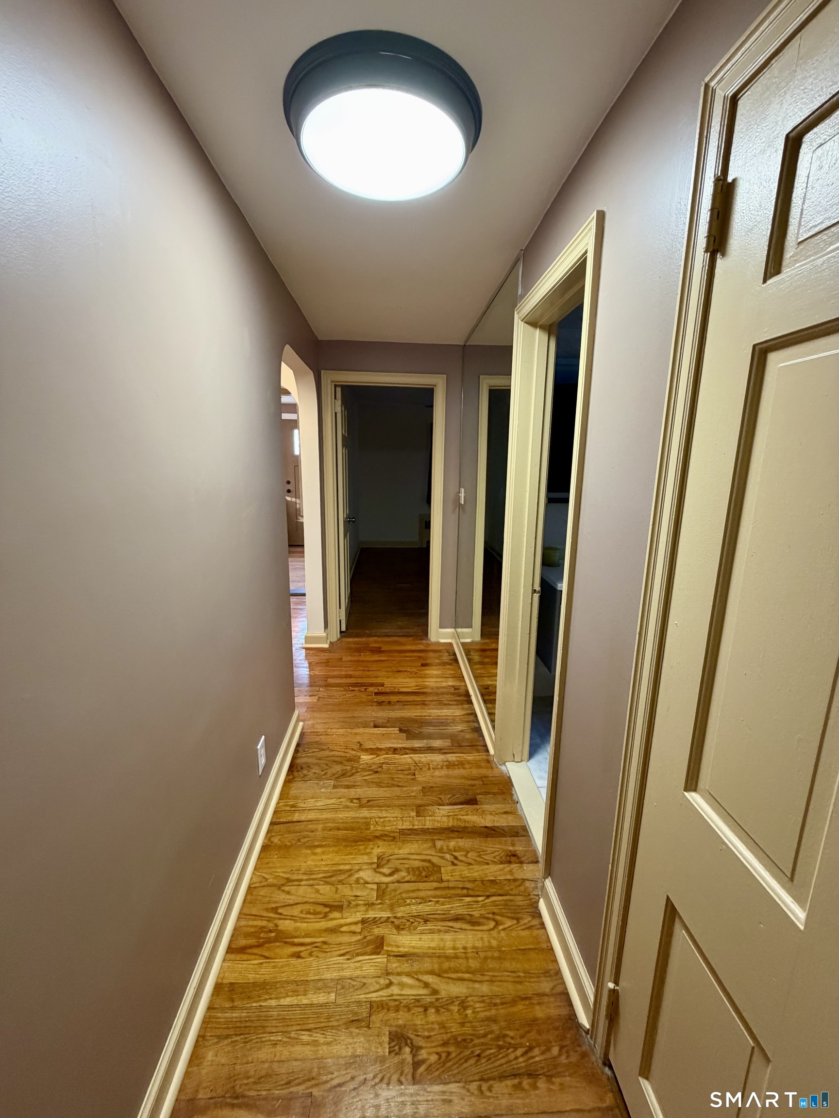 40 Nepaug Street Hartford, CT 06106 - Photo 9 of 19 a view of a hallway with wooden floor and a chandelier