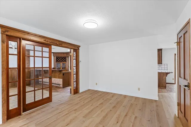 a view of a kitchen with a sink and windows