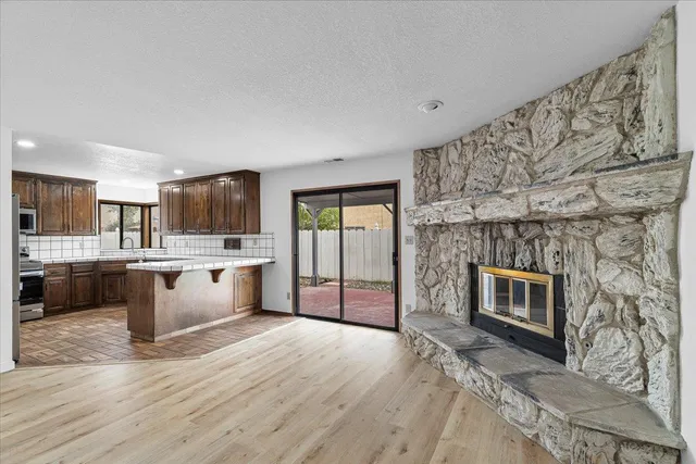 a bathroom with a sink a toilet a mirror a bathtub and shower