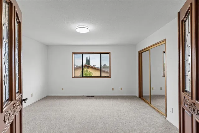 a view of an empty room with a window