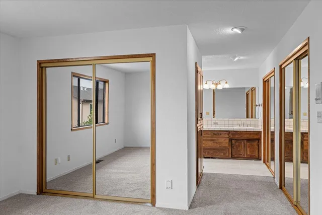 a view of an empty room and fire place