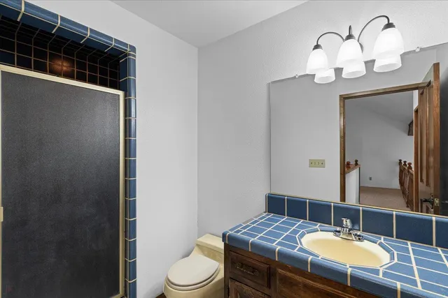 a bathroom with a double vanity sink and mirror