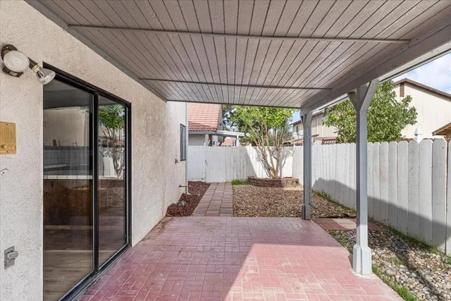 a bathroom with a granite countertop sink toilet a mirror and shower