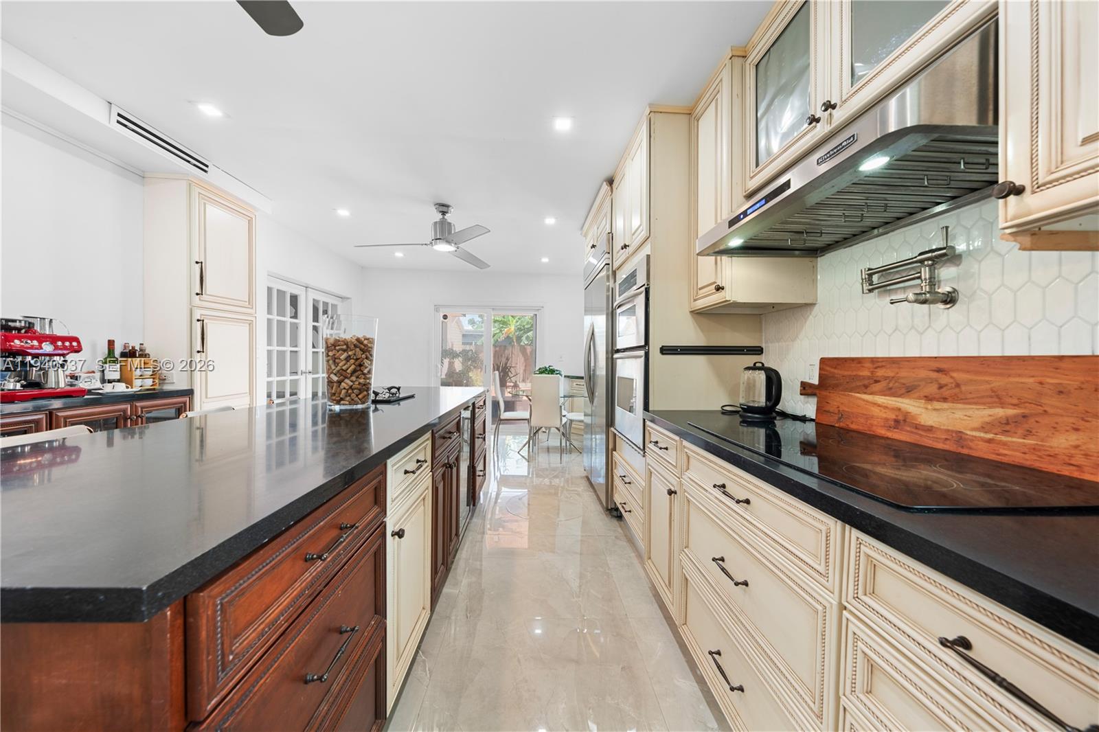 6423 Southwest 107th Place Miami, FL 33173 - Photo 15 of 37 a kitchen with stainless steel appliances granite countertop lots of counter top space
