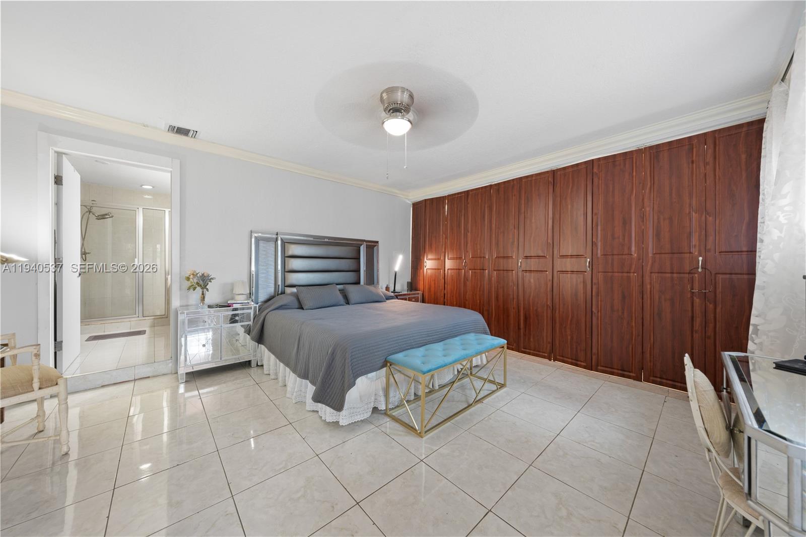 6423 Southwest 107th Place Miami, FL 33173 - Photo 21 of 37 a bedroom with a bed and a large mirror