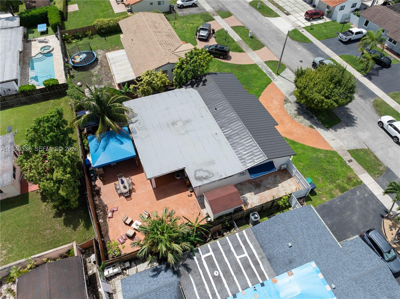 6423 Southwest 107th Place Miami, FL 33173 - Photo 34 of 37 an aerial view of a house with garden space and street view