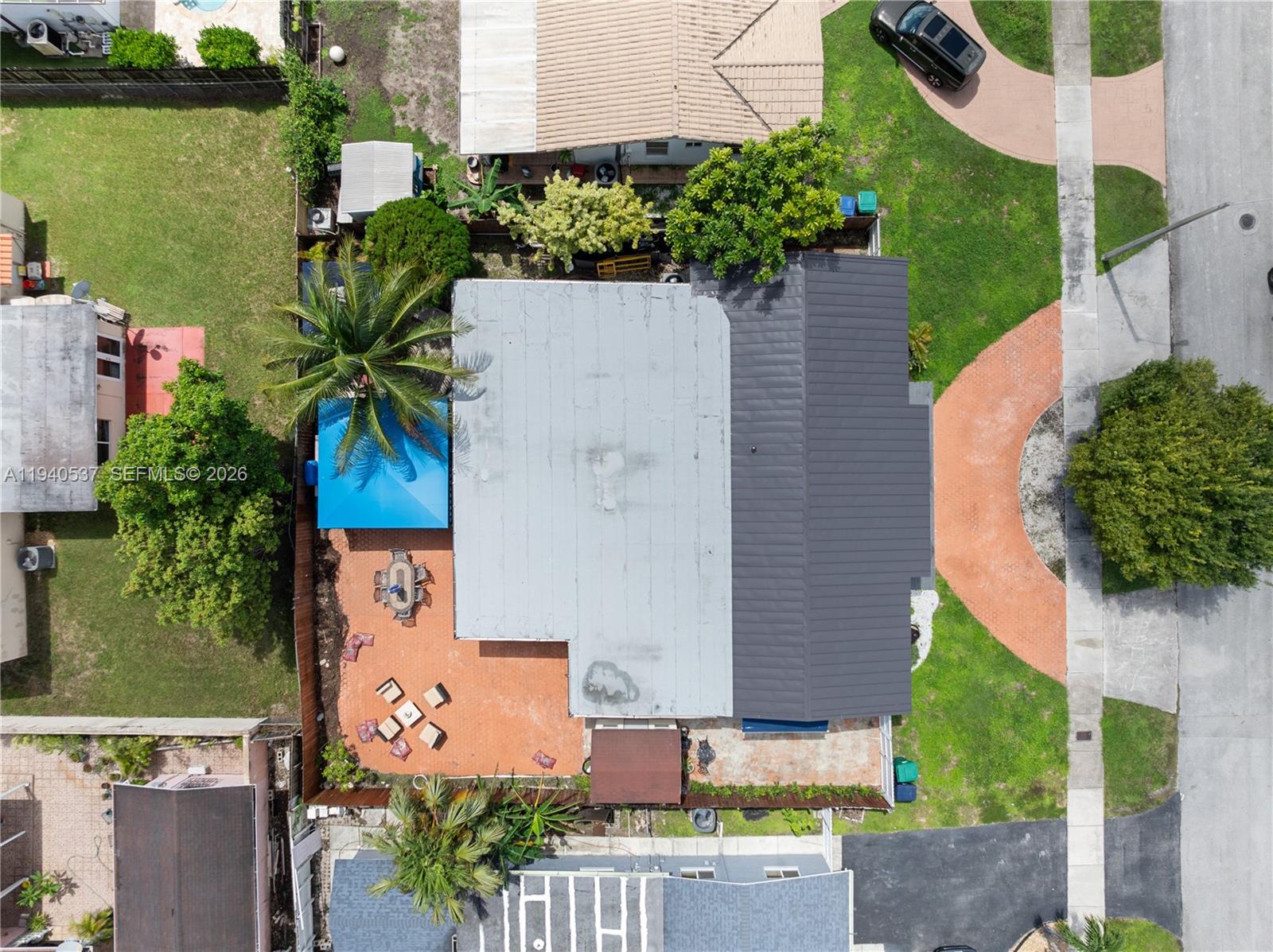6423 Southwest 107th Place Miami, FL 33173 - Photo 35 of 37 an aerial view of a house with a yard and garden