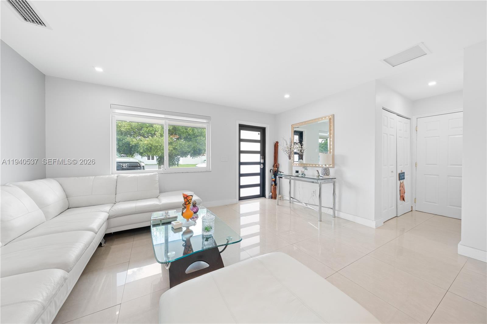 6423 Southwest 107th Place Miami, FL 33173 - Photo 8 of 37 a living room with furniture and a couch