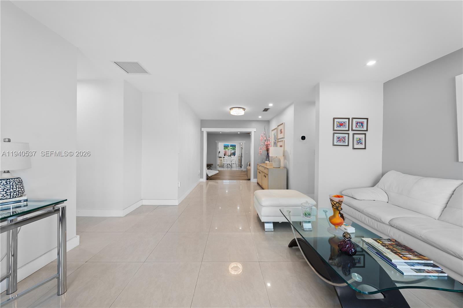 6423 Southwest 107th Place Miami, FL 33173 - Photo 10 of 37 a living room with furniture and a couch