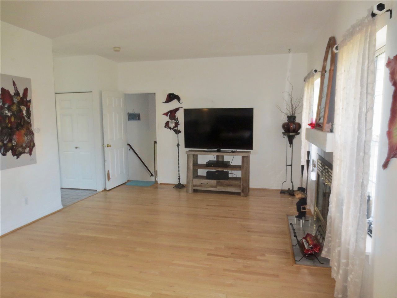 140 Pembroke Road Southwest Poplar Grove, IL 61065 - Photo 12 of 26 a view of a livingroom with furniture and a flat screen tv