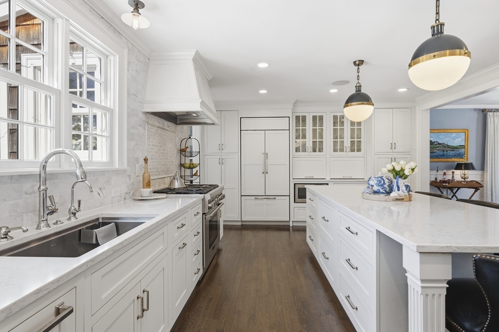 16 Pickwick Road Marblehead, MA 01945 - Photo 11 of 30 a large white kitchen with a double vanity sink and a stove