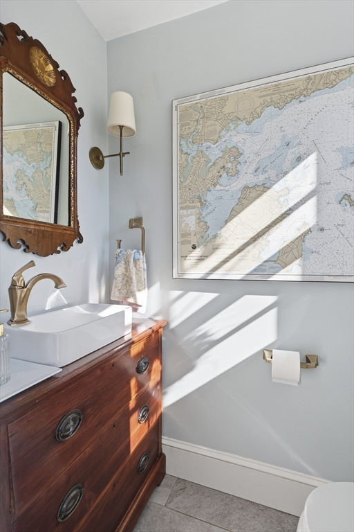 16 Pickwick Road Marblehead, MA 01945 - Photo 15 of 30 a bathroom with a sink a vanity and mirror