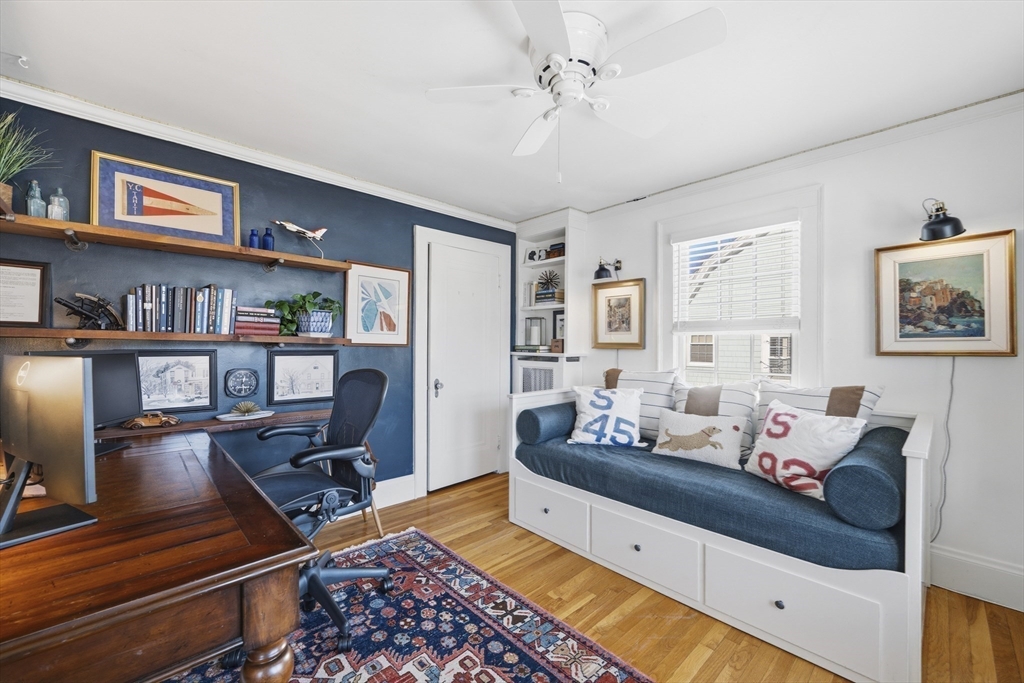 16 Pickwick Road Marblehead, MA 01945 - Photo 22 of 30 a living room with furniture and a bookshelf