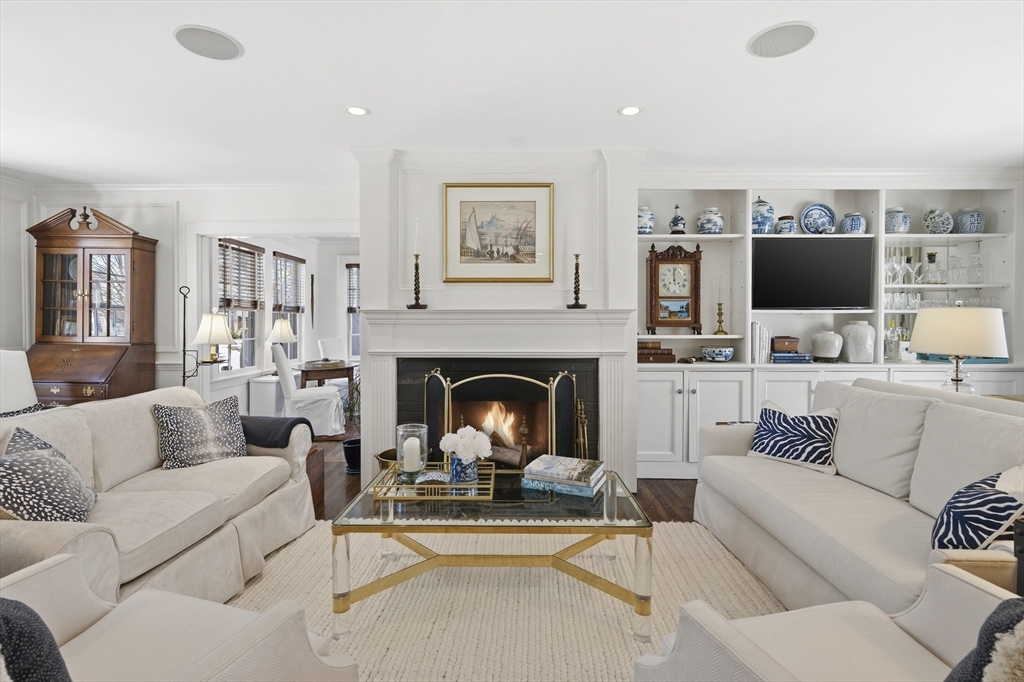16 Pickwick Road Marblehead, MA 01945 - Photo 3 of 30 a living room with furniture a fireplace and a flat screen tv