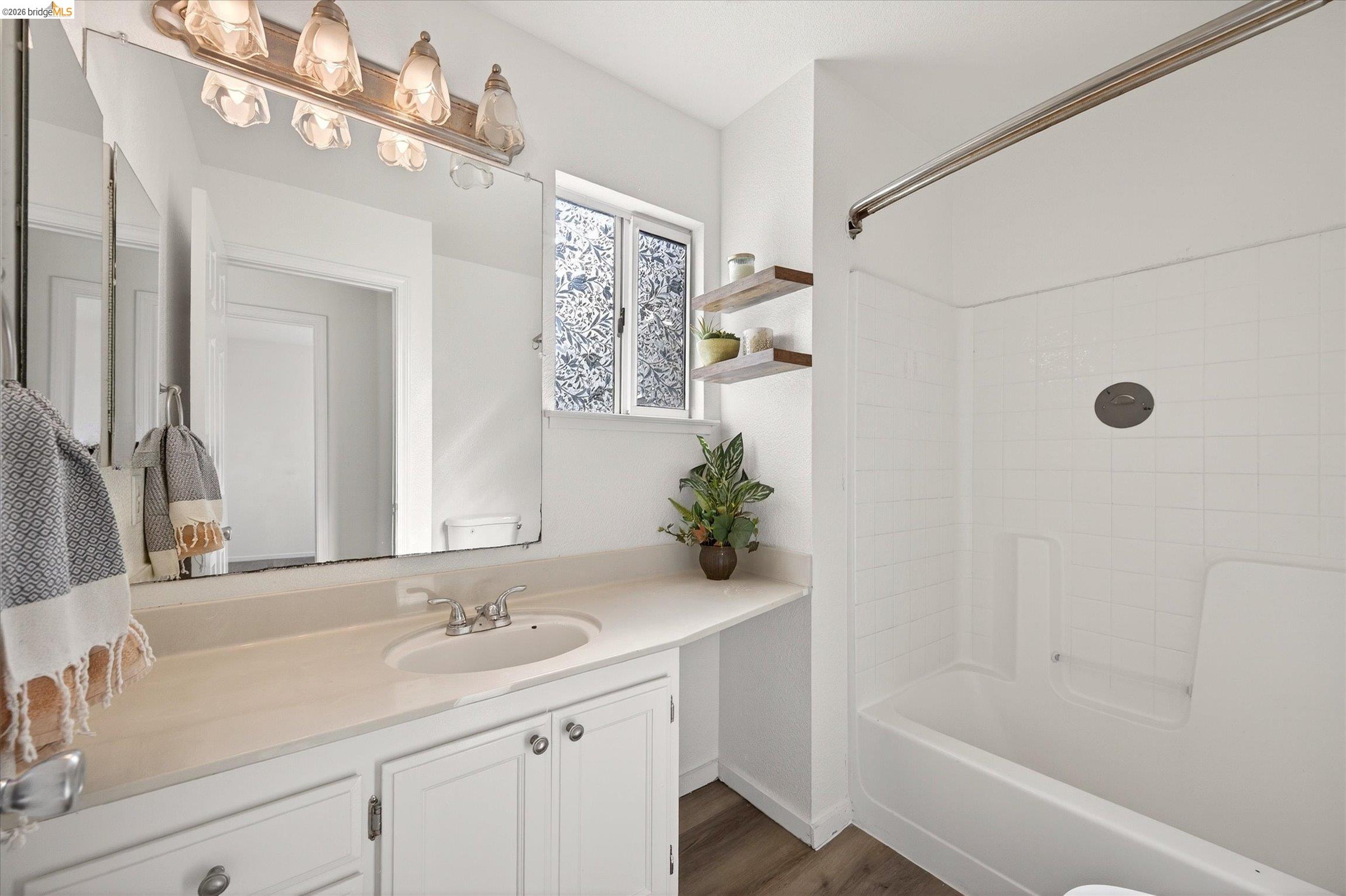 1120 Deerpark Road Oakley, CA 94561 - Photo 25 of 30 Bathroom featuring a single vanity with an integrated sink, white cabinetry, and brushed nickel hardware