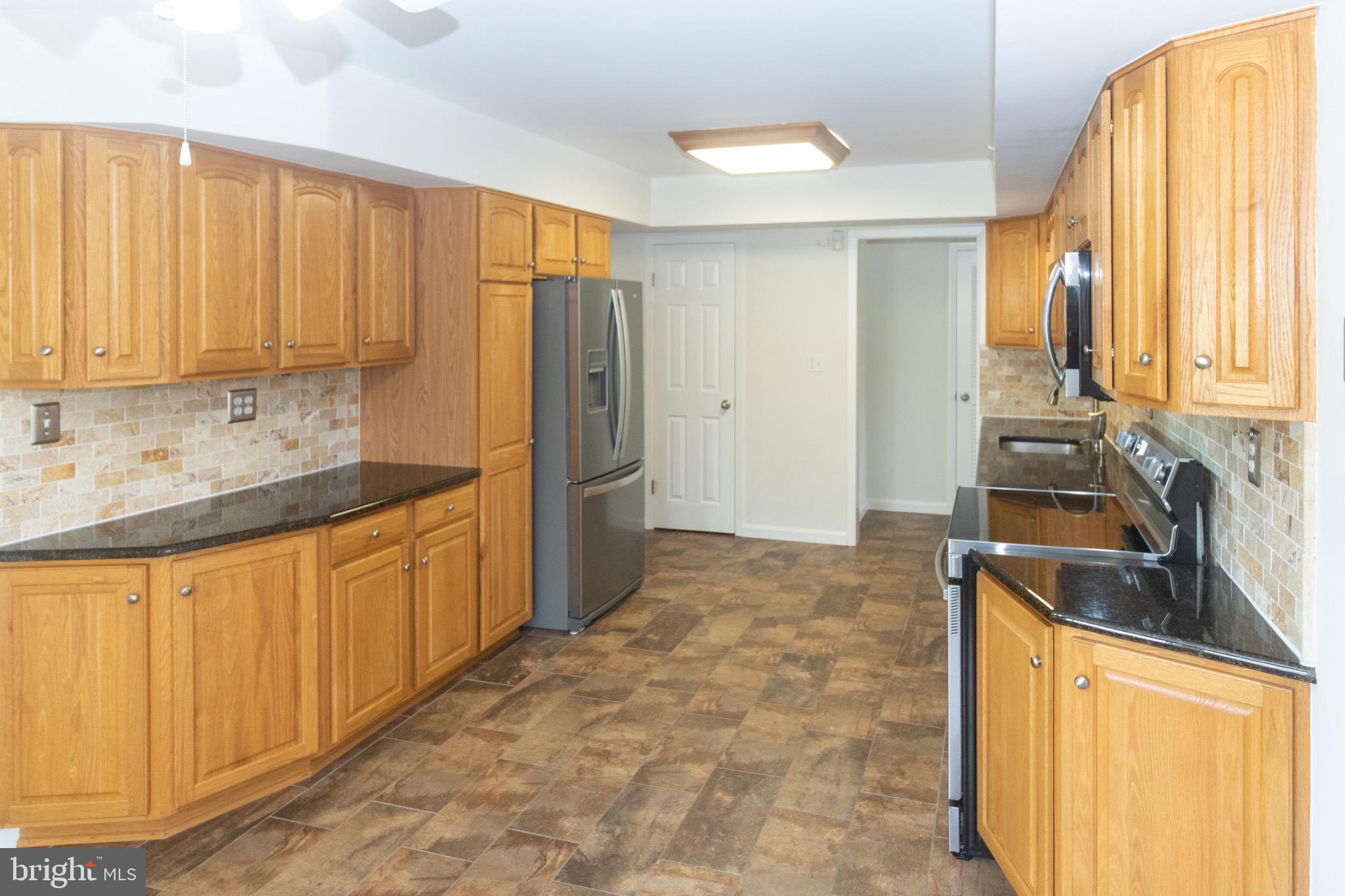 27 Orchard Lane Westampton, NJ 08060 - Photo 7 of 35 Additional oak cabinets, pantry & stainless refri