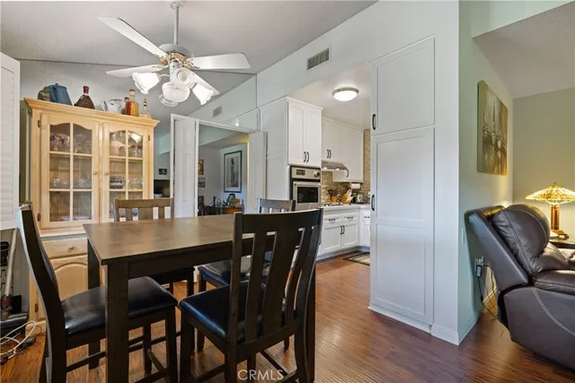 a bedroom with a bed and wooden furniture
