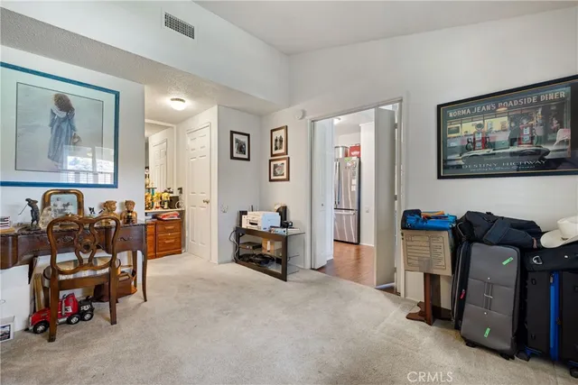 a bathroom with a sink mirror and toilet