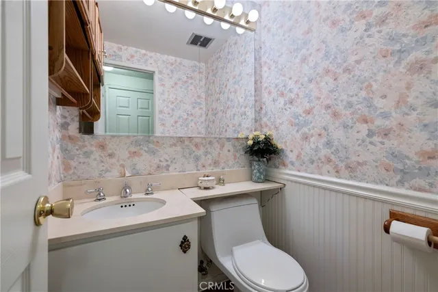 a view of a livingroom with furniture and a window